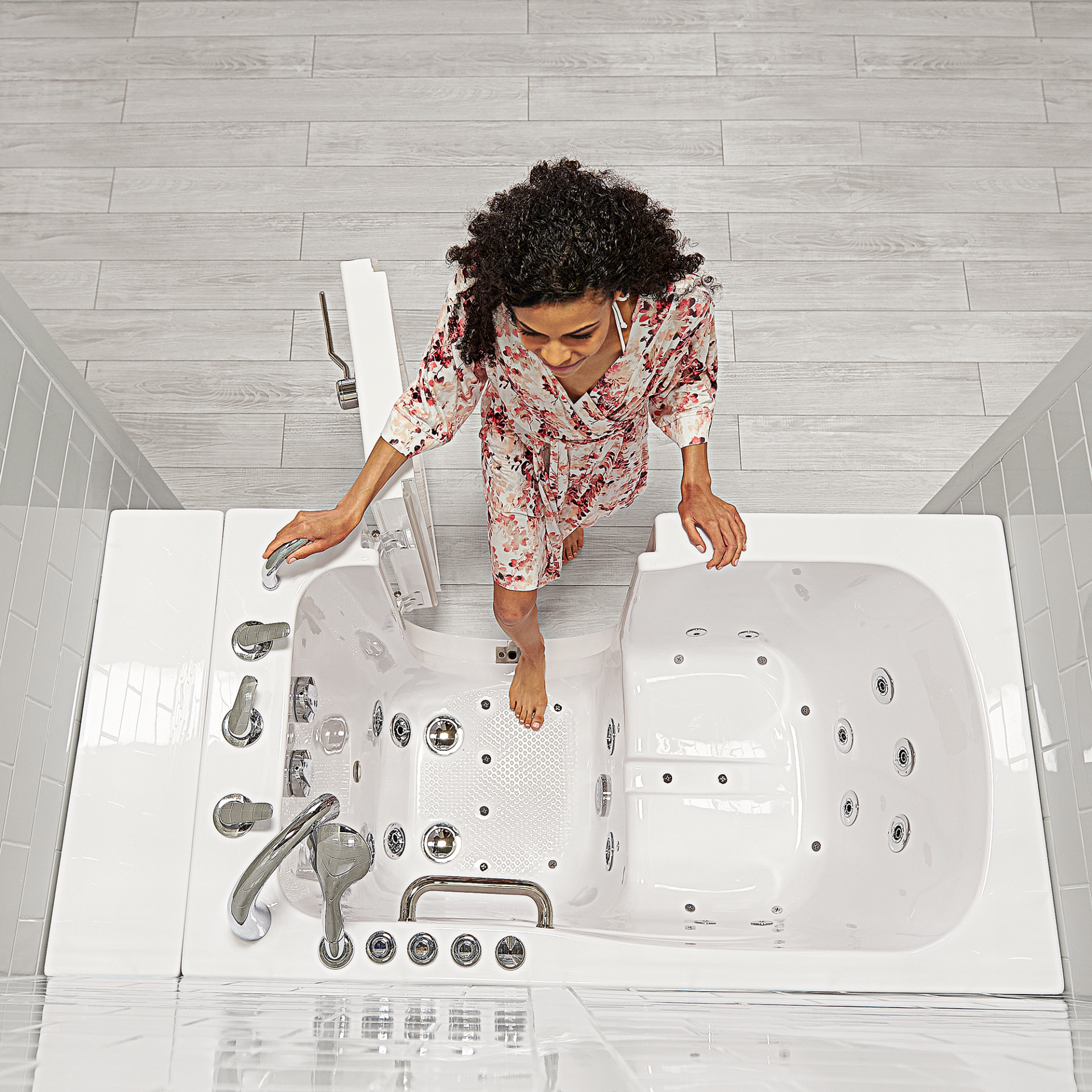 Walk-in tub with an open entry door and built-in seat — product example